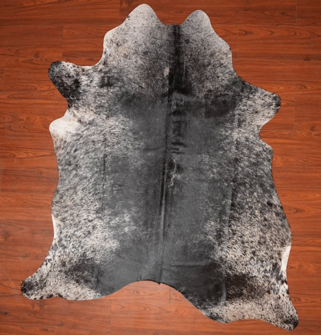 The Nguni Guy Nguni cowhide African decor Authentic cowhide Home decor Interior design Unique pattern Hand-selected Premium quality Natural beauty Exotic rug Genuine hide Statement piece Contemporary style Ethically sourced Sustainable decor Versatile accent Luxury rug Designer piece Modern aesthetic High-end craftsmanship Timeless elegance Designer home accents