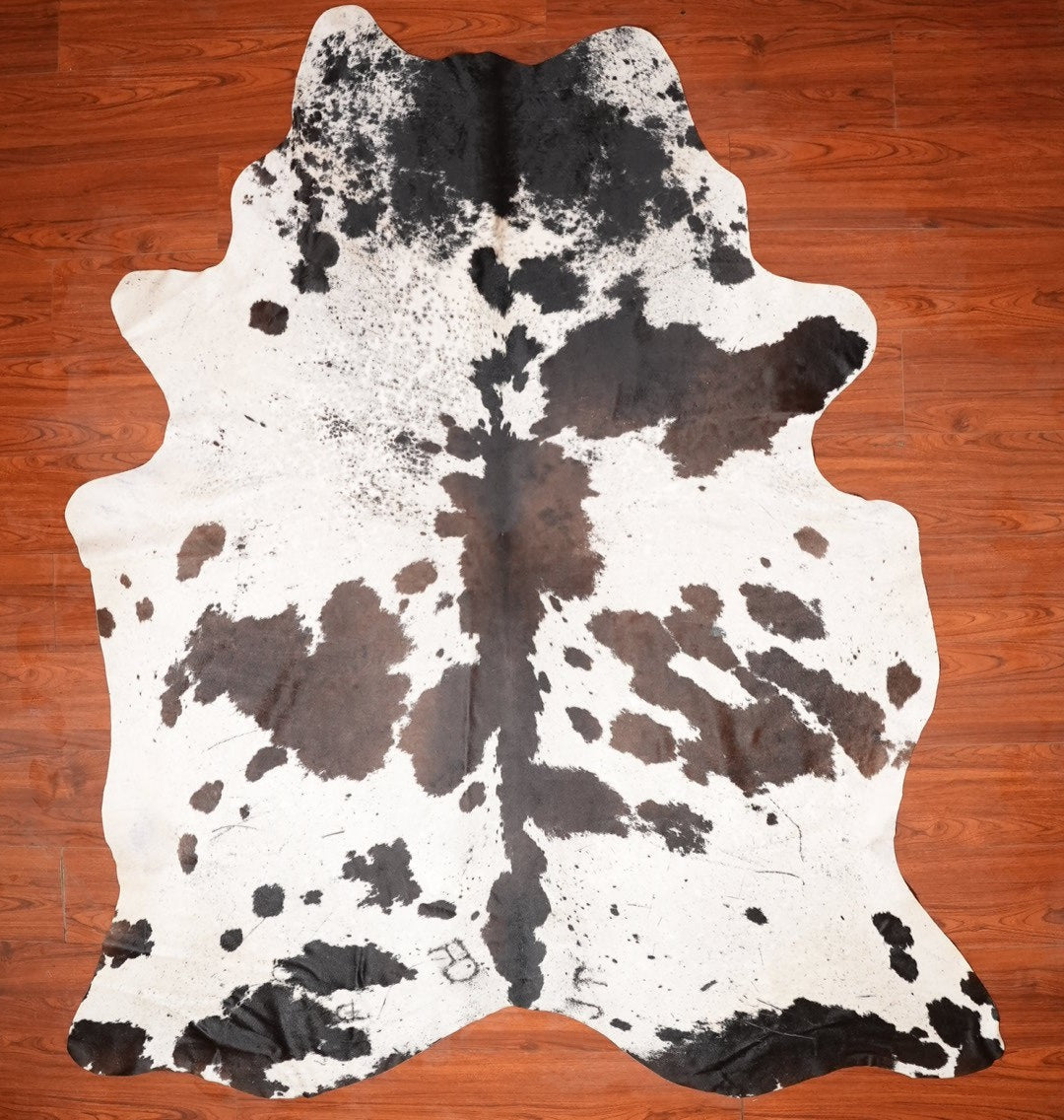 The Nguni Guy Nguni cowhide African decor Authentic cowhide Home decor Interior design Unique pattern Hand-selected Premium quality Natural beauty Exotic rug Genuine hide Statement piece Contemporary style Ethically sourced Sustainable decor Versatile accent Luxury rug Designer piece Modern aesthetic High-end craftsmanship Timeless elegance Designer home accents