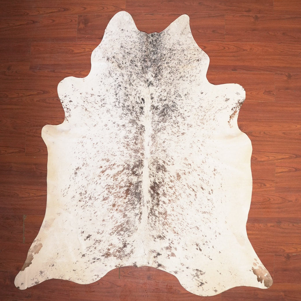 cowhide rug on wood floor