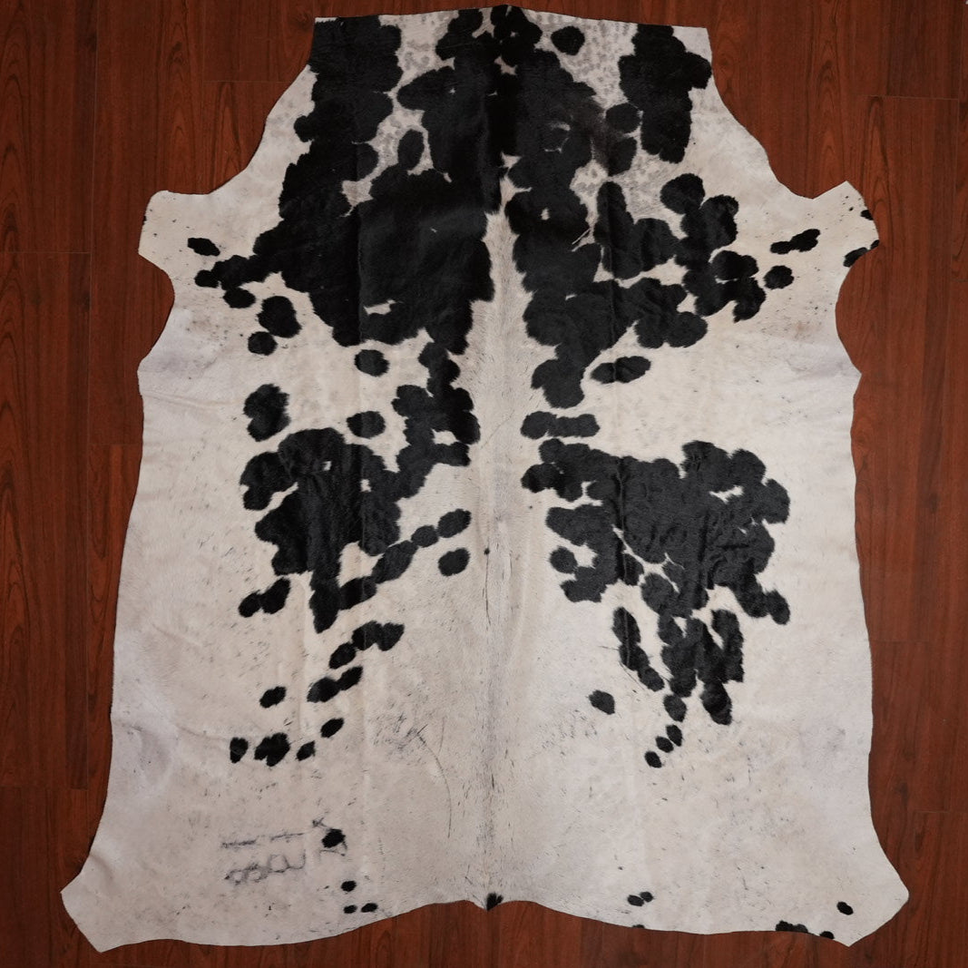The Nguni Guy Nguni cowhide African decor Authentic cowhide Home decor Interior design Unique pattern Hand-selected Premium quality Natural beauty Exotic rug Genuine hide Statement piece Contemporary style Ethically sourced Sustainable decor Versatile accent Luxury rug Designer piece Modern aesthetic High-end craftsmanship Timeless elegance Designer home accents