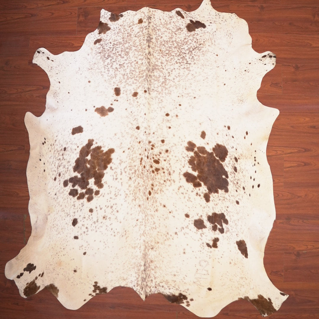 The Nguni Guy Nguni cowhide African decor Authentic cowhide Home decor Interior design Unique pattern Hand-selected Premium quality Natural beauty Exotic rug Genuine hide Statement piece Contemporary style Ethically sourced Sustainable decor Versatile accent Luxury rug Designer piece Modern aesthetic High-end craftsmanship Timeless elegance Designer home accents