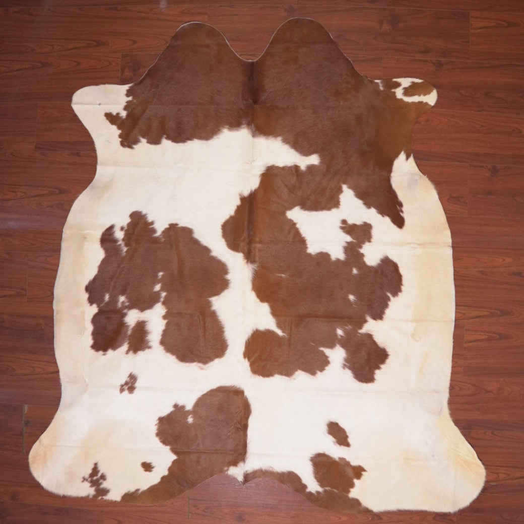 cowhide rug on wood floor