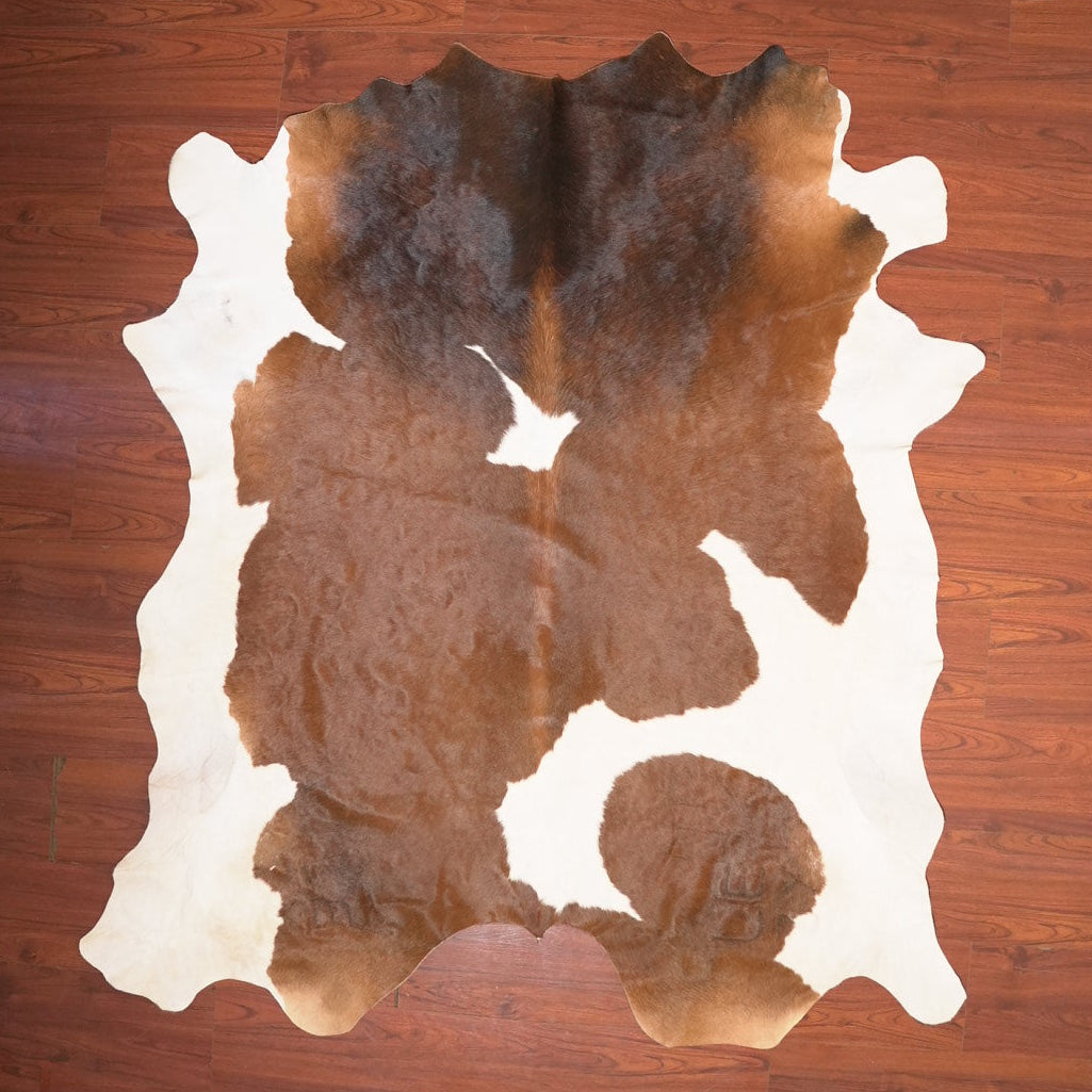 The Nguni Guy Nguni cowhide African decor Authentic cowhide Home decor Interior design Unique pattern Hand-selected Premium quality Natural beauty Exotic rug Genuine hide Statement piece Contemporary style Ethically sourced Sustainable decor Versatile accent Luxury rug Designer piece Modern aesthetic High-end craftsmanship Timeless elegance Designer home accents