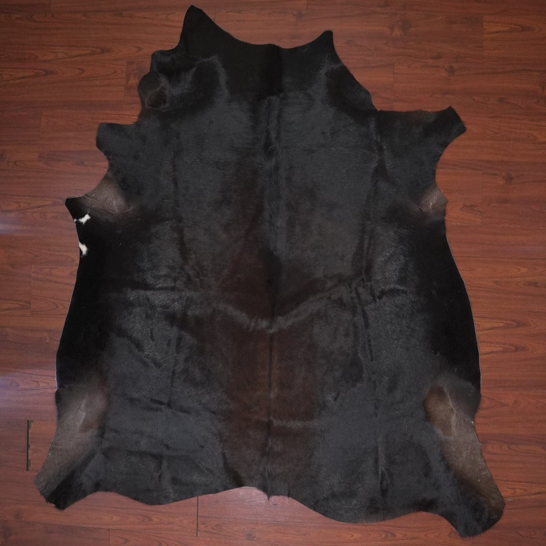 cowhide rug on wood floor