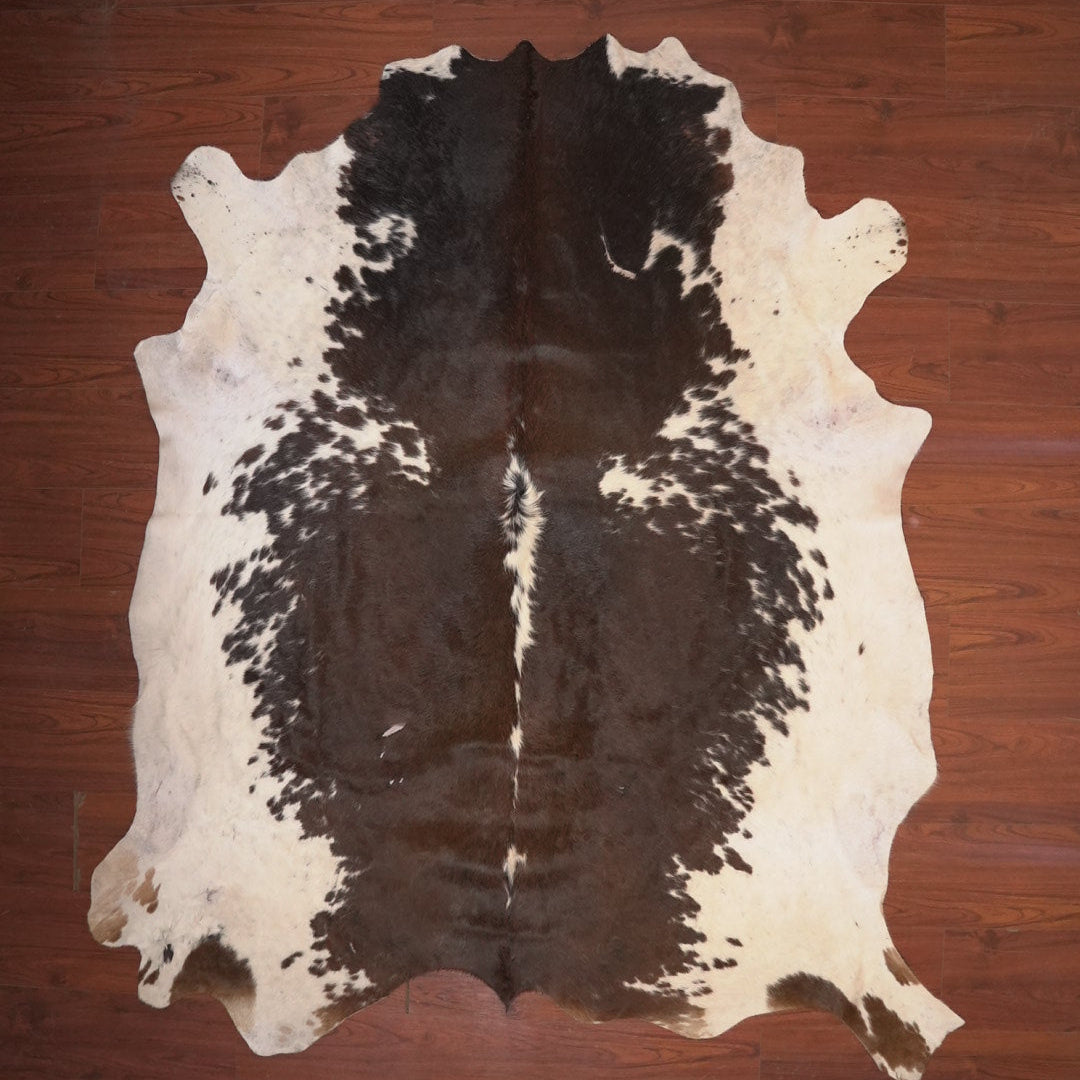 cow hide rug on wood floor