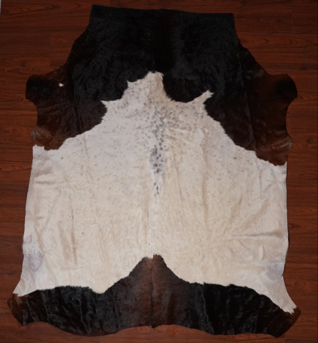 The Nguni Guy Nguni cowhide African decor Authentic cowhide Home decor Interior design Unique pattern Hand-selected Premium quality Natural beauty Exotic rug Genuine hide Statement piece Contemporary style Ethically sourced Sustainable decor Versatile accent Luxury rug Designer piece Modern aesthetic High-end craftsmanship Timeless elegance Designer home accents