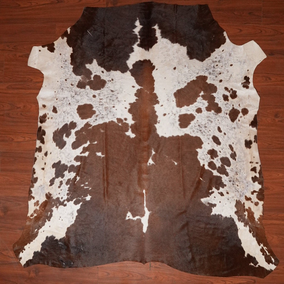 The Nguni Guy Nguni cowhide African decor Authentic cowhide Home decor Interior design Unique pattern Hand-selected Premium quality Natural beauty Exotic rug Genuine hide Statement piece Contemporary style Ethically sourced Sustainable decor Versatile accent Luxury rug Designer piece Modern aesthetic High-end craftsmanship Timeless elegance Designer home accents