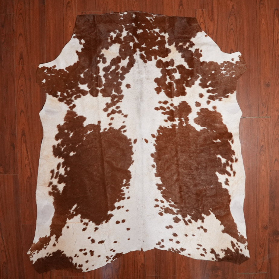 The Nguni Guy Nguni cowhide African decor Authentic cowhide Home decor Interior design Unique pattern Hand-selected Premium quality Natural beauty Exotic rug Genuine hide Statement piece Contemporary style Ethically sourced Sustainable decor Versatile accent Luxury rug Designer piece Modern aesthetic High-end craftsmanship Timeless elegance Designer home accents