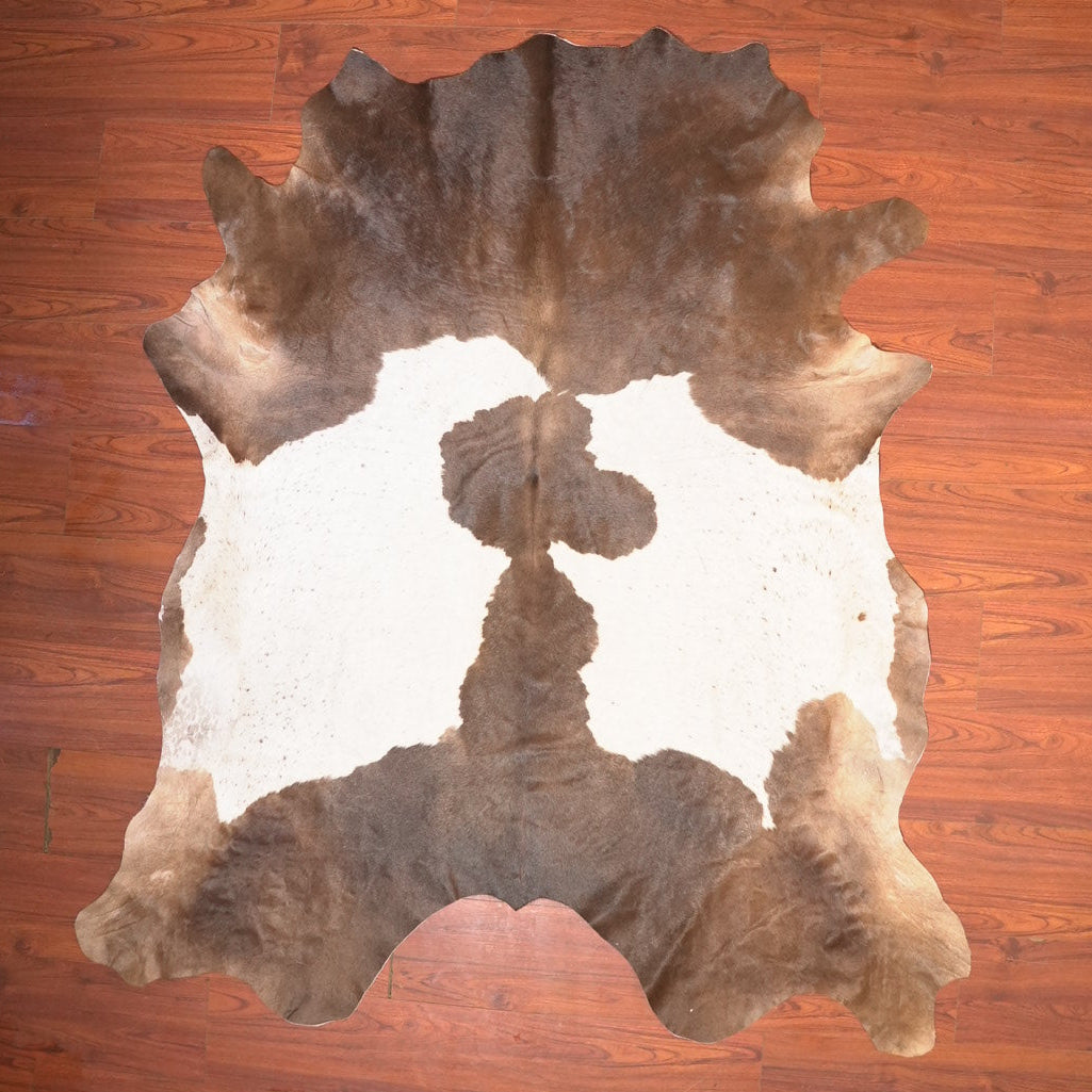 Cowhide rug on a wooden floor
