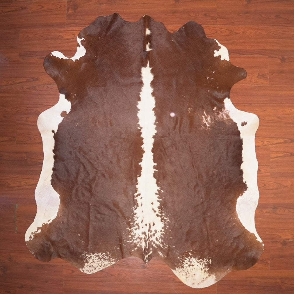 The Nguni Guy Nguni cowhide African decor Authentic cowhide Home decor Interior design Unique pattern Hand-selected Premium quality Natural beauty Exotic rug Genuine hide Statement piece Contemporary style Ethically sourced Sustainable decor Versatile accent Luxury rug Designer piece Modern aesthetic High-end craftsmanship Timeless elegance Designer home accents
