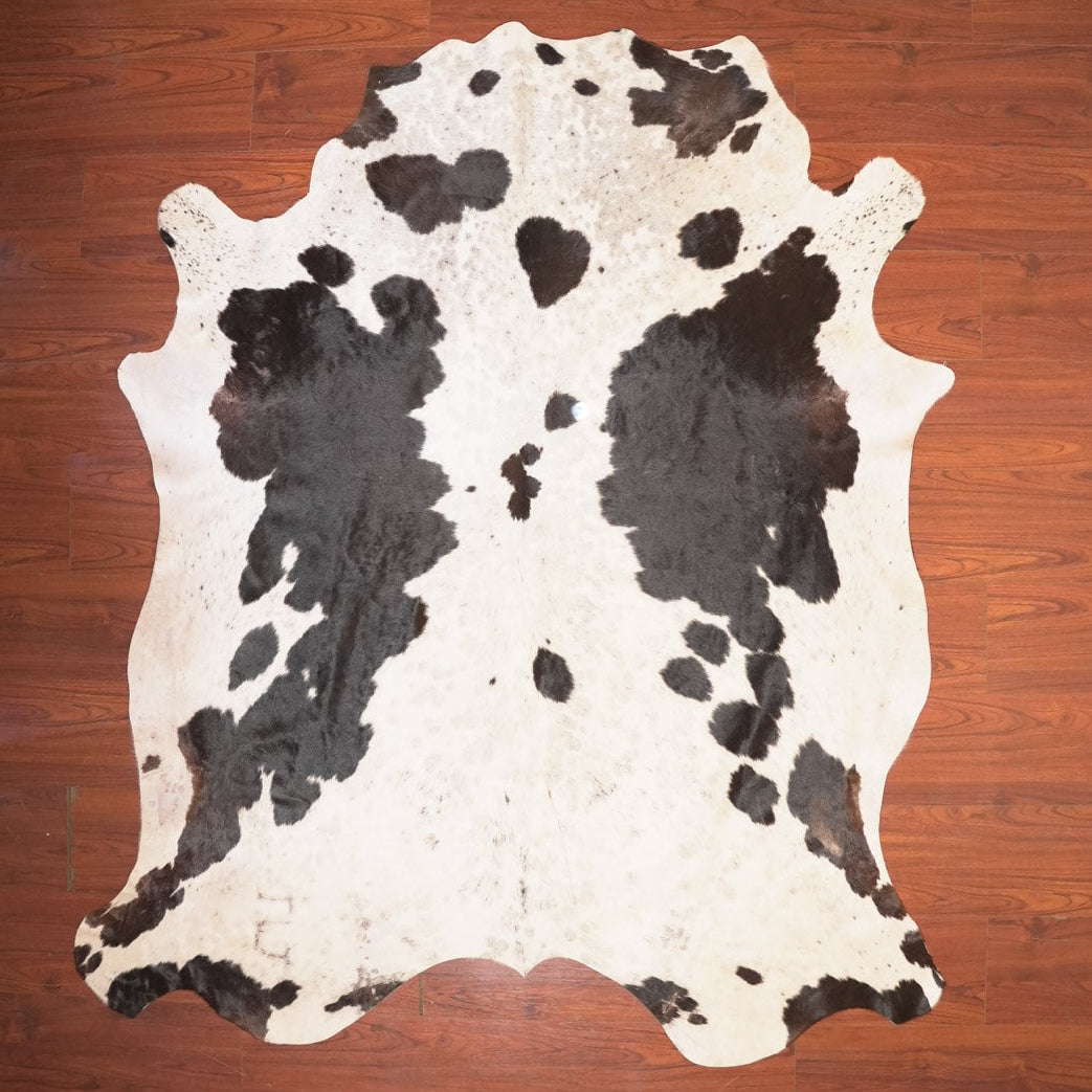 The Nguni Guy Nguni cowhide African decor Authentic cowhide Home decor Interior design Unique pattern Hand-selected Premium quality Natural beauty Exotic rug Genuine hide Statement piece Contemporary style Ethically sourced Sustainable decor Versatile accent Luxury rug Designer piece Modern aesthetic High-end craftsmanship Timeless elegance Designer home accents