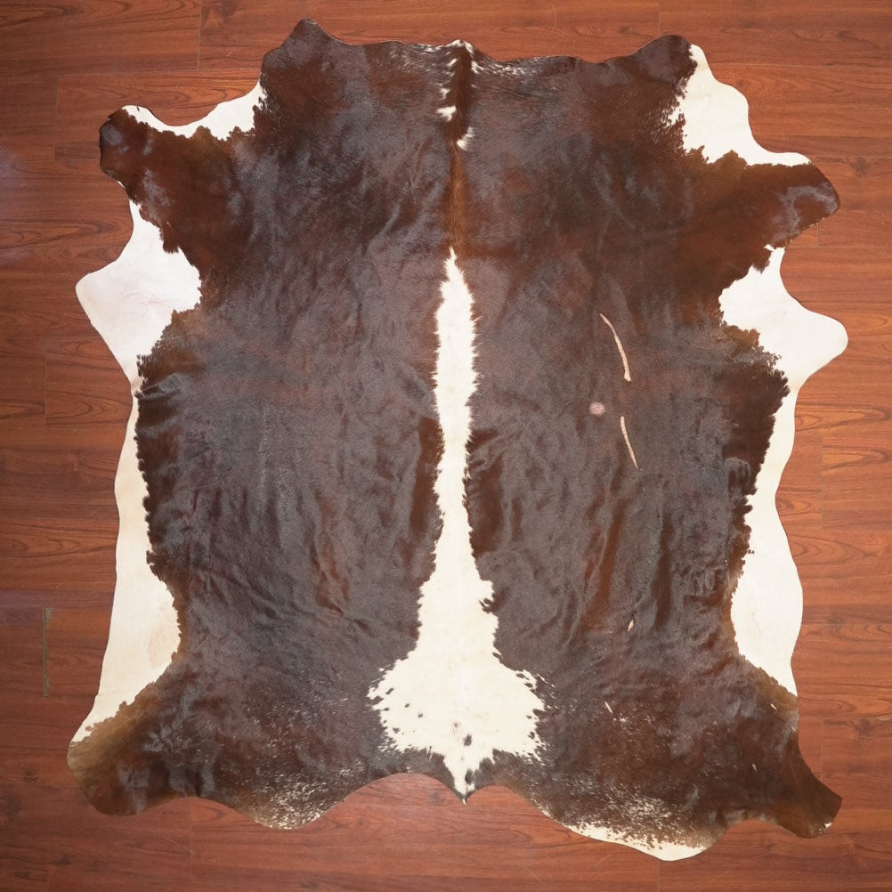 The Nguni Guy Nguni cowhide African decor Authentic cowhide Home decor Interior design Unique pattern Hand-selected Premium quality Natural beauty Exotic rug Genuine hide Statement piece Contemporary style Ethically sourced Sustainable decor Versatile accent Luxury rug Designer piece Modern aesthetic High-end craftsmanship Timeless elegance Designer home accents