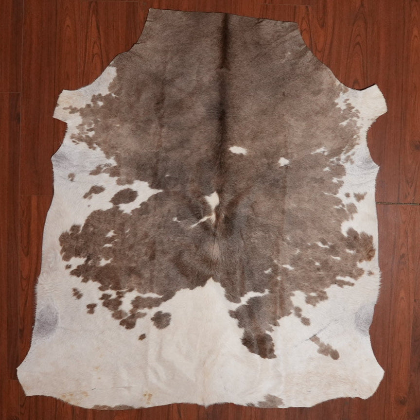 The Nguni Guy Nguni cowhide African decor Authentic cowhide Home decor Interior design Unique pattern Hand-selected Premium quality Natural beauty Exotic rug Genuine hide Statement piece Contemporary style Ethically sourced Sustainable decor Versatile accent Luxury rug Designer piece Modern aesthetic High-end craftsmanship Timeless elegance Designer home accents