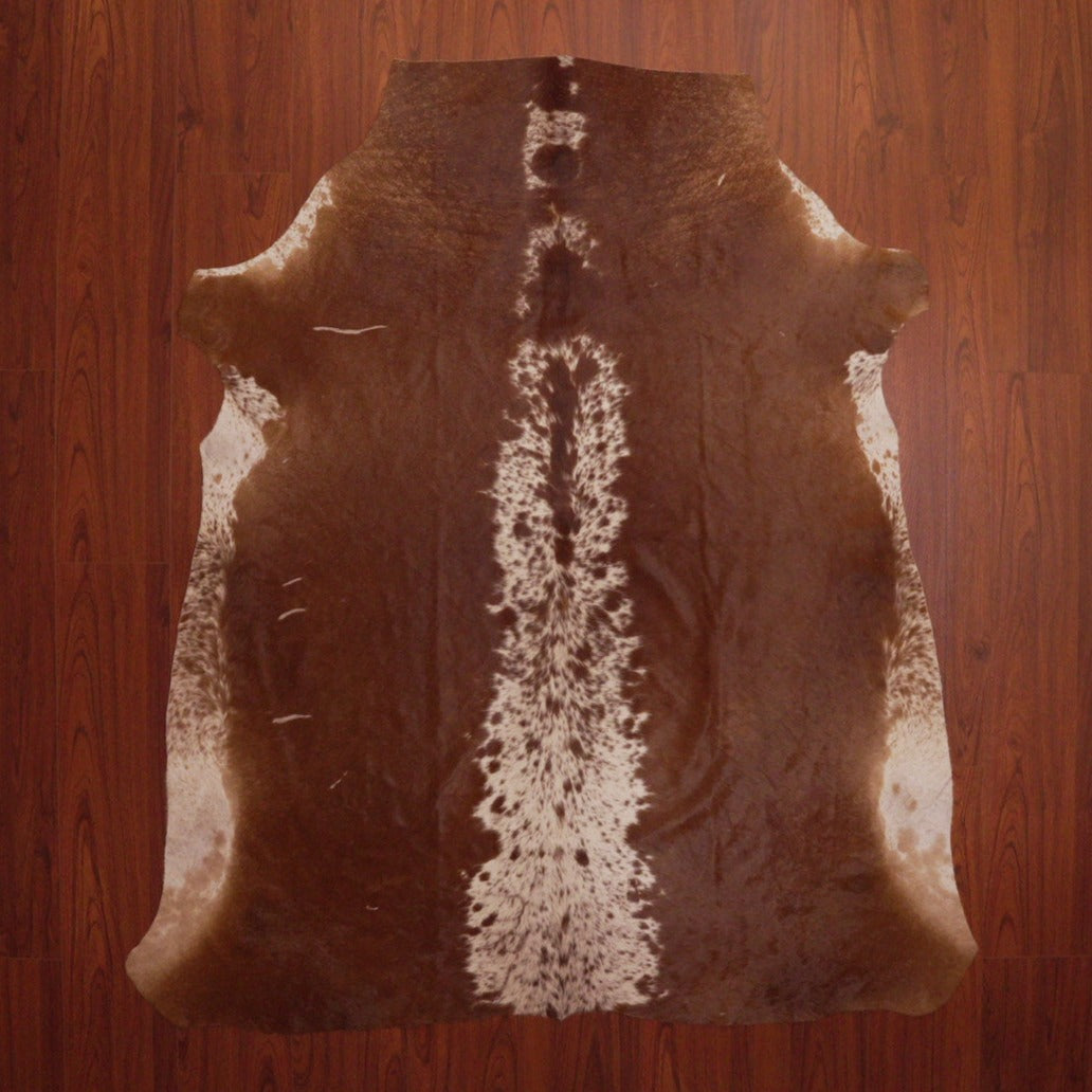 The Nguni Guy Brown And White Nguni Cowhide Rug solid speckled