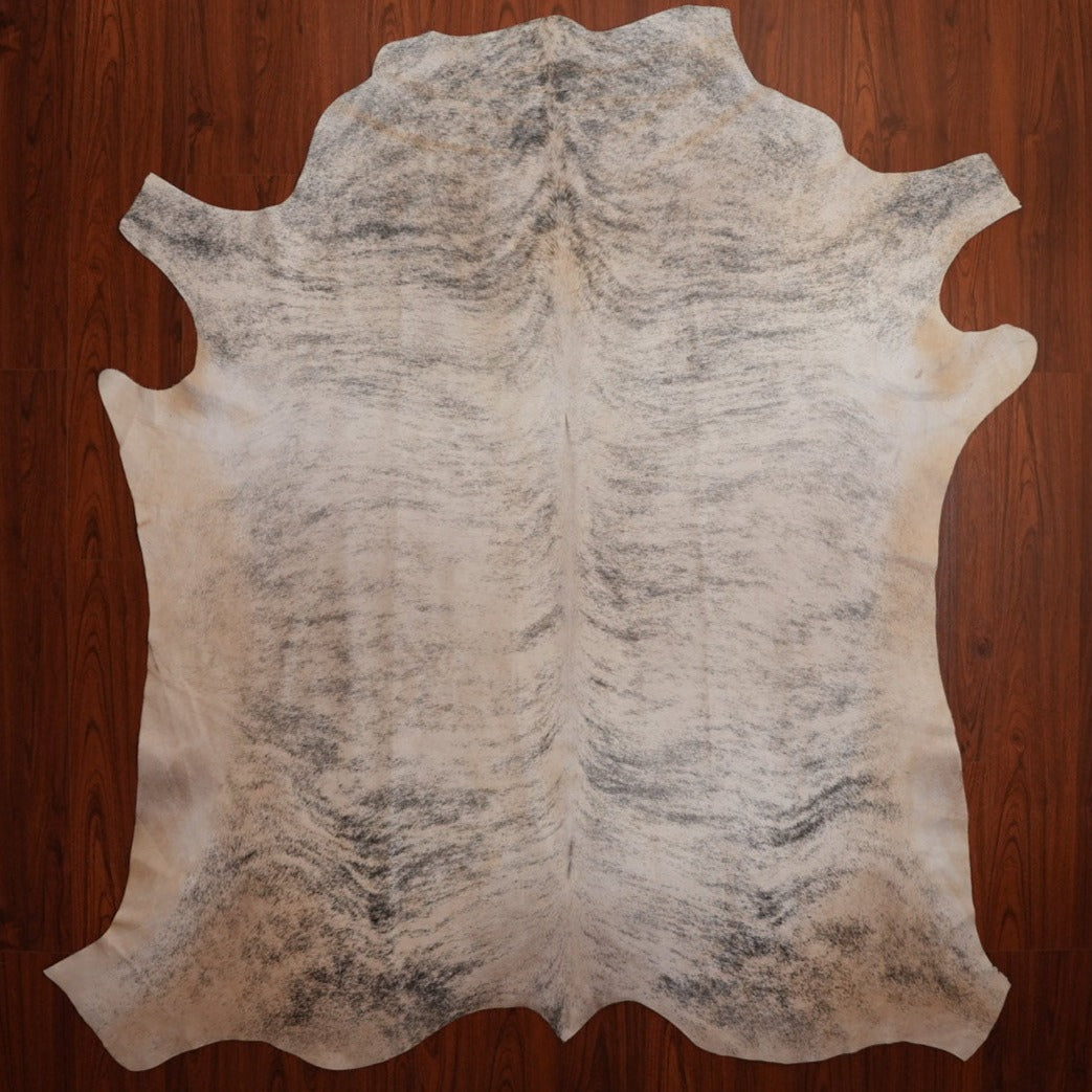 The Nguni Guy Nguni cowhide Black and white cowhide Speckled cowhide African decor Authentic cowhide Home decor Interior design Unique pattern Hand-selected Premium quality Natural beauty Exotic rug Genuine hide Statement piece Contemporary style Ethically sourced Sustainable decor Versatile accent Luxury rug Designer piece Modern aesthetic High-end craftsmanship Timeless elegance Designer home accents