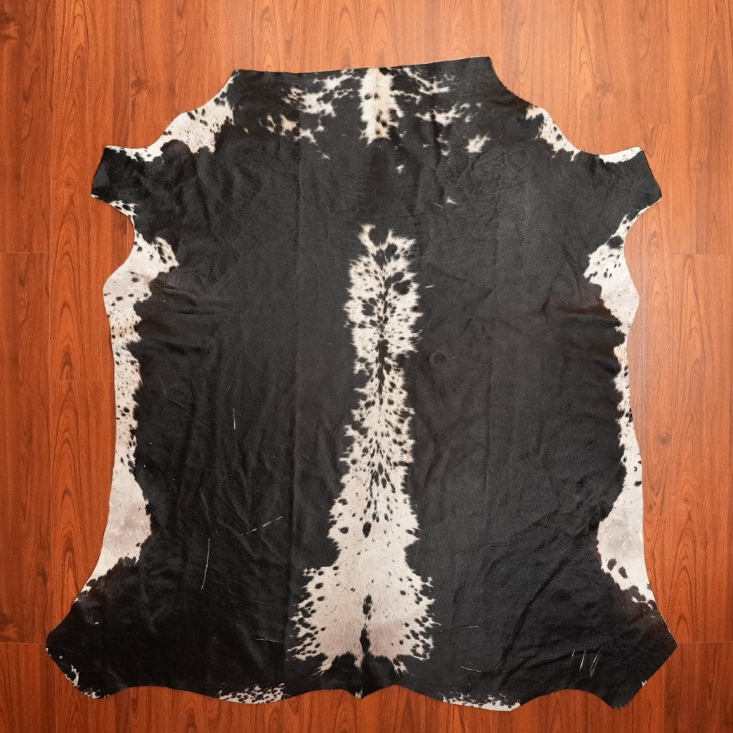 The Nguni Guy Nguni cowhide Black and white cowhide Speckled cowhide African decor Authentic cowhide Home decor Interior design Unique pattern Hand-selected Premium quality Natural beauty Exotic rug Genuine hide Statement piece Contemporary style Ethically sourced Sustainable decor Versatile accent Luxury rug Designer piece Modern aesthetic High-end craftsmanship Timeless elegance Designer home accents