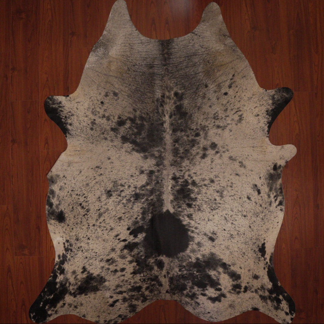 The Nguni Guy Nguni cowhide Black and white cowhide Speckled cowhide African decor Authentic cowhide Home decor Interior design Unique pattern Hand-selected Premium quality Natural beauty Exotic rug Genuine hide Statement piece Contemporary style Ethically sourced Sustainable decor Versatile accent Luxury rug Designer piece Modern aesthetic High-end craftsmanship Timeless elegance Designer home accents