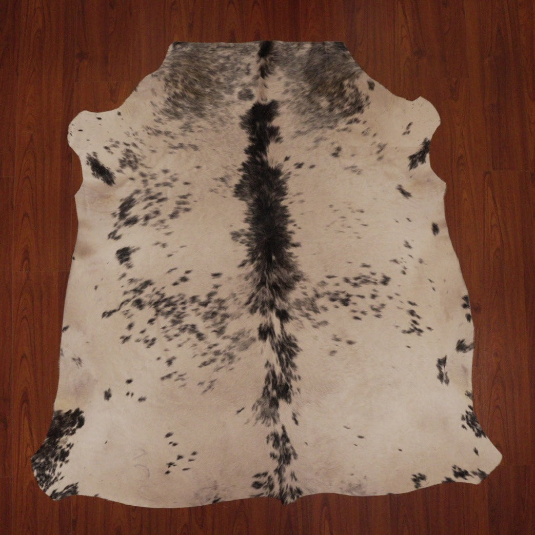 The Nguni Guy Nguni cowhide Black and white cowhide Speckled cowhide African decor Authentic cowhide Home decor Interior design Unique pattern Hand-selected Premium quality Natural beauty Exotic rug Genuine hide Statement piece Contemporary style Ethically sourced Sustainable decor Versatile accent Luxury rug Designer piece Modern aesthetic High-end craftsmanship Timeless elegance Designer home accents