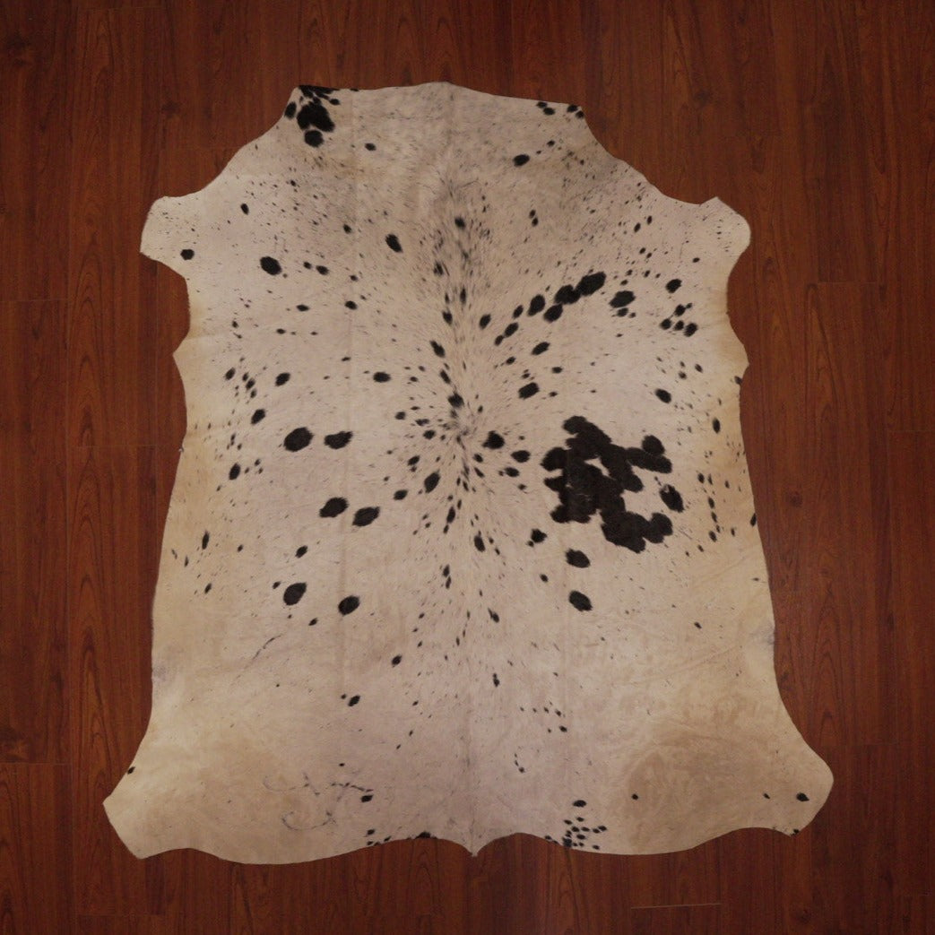The Nguni Guy Nguni cowhide Black and white cowhide Speckled cowhide African decor Authentic cowhide Home decor Interior design Unique pattern Hand-selected Premium quality Natural beauty Exotic rug Genuine hide Statement piece Contemporary style Ethically sourced Sustainable decor Versatile accent Luxury rug Designer piece Modern aesthetic High-end craftsmanship Timeless elegance Designer home accents