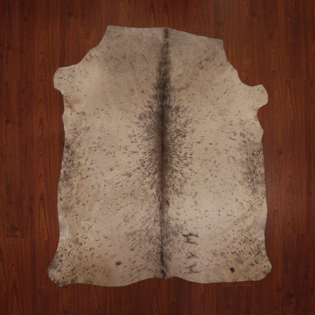 The Nguni Guy Nguni cowhide Black and white cowhide Speckled cowhide African decor Authentic cowhide Home decor Interior design Unique pattern Hand-selected Premium quality Natural beauty Exotic rug Genuine hide Statement piece Contemporary style Ethically sourced Sustainable decor Versatile accent Luxury rug Designer piece Modern aesthetic High-end craftsmanship Timeless elegance Designer home accents