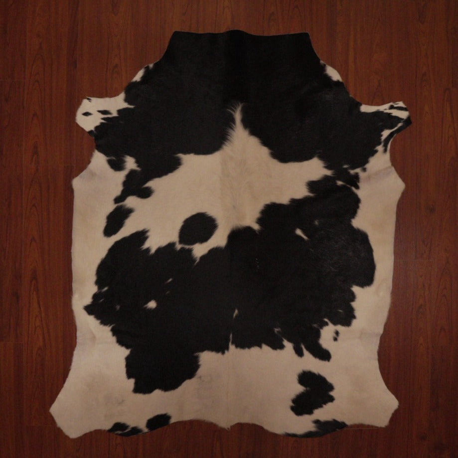 The Nguni Guy Nguni cowhide Black and white cowhide Panelled cowhide African decor Authentic cowhide Home decor Interior design Unique pattern Hand-selected Premium quality Natural beauty Exotic rug Genuine hide Statement piece Contemporary style Ethically sourced Sustainable decor Versatile accent Luxury rug Designer piece Modern aesthetic High-end craftsmanship Timeless elegance Designer home accents