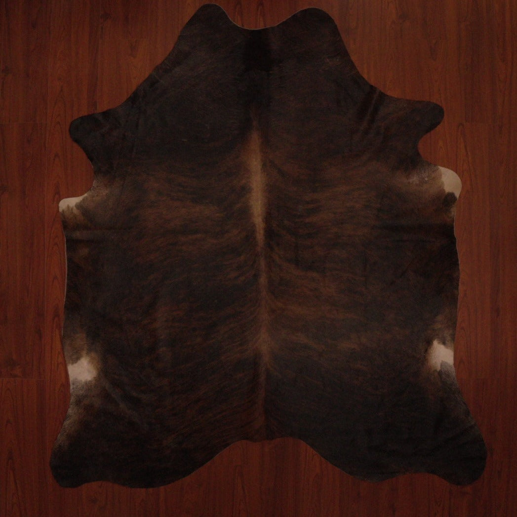 The Nguni Guy Nguni cowhide African decor Authentic cowhide Home decor Interior design Unique pattern Hand-selected Premium quality Natural beauty Exotic rug Genuine hide Statement piece Contemporary style Ethically sourced Sustainable decor Versatile accent Luxury rug Designer piece Modern aesthetic High-end craftsmanship Timeless elegance Designer home accents