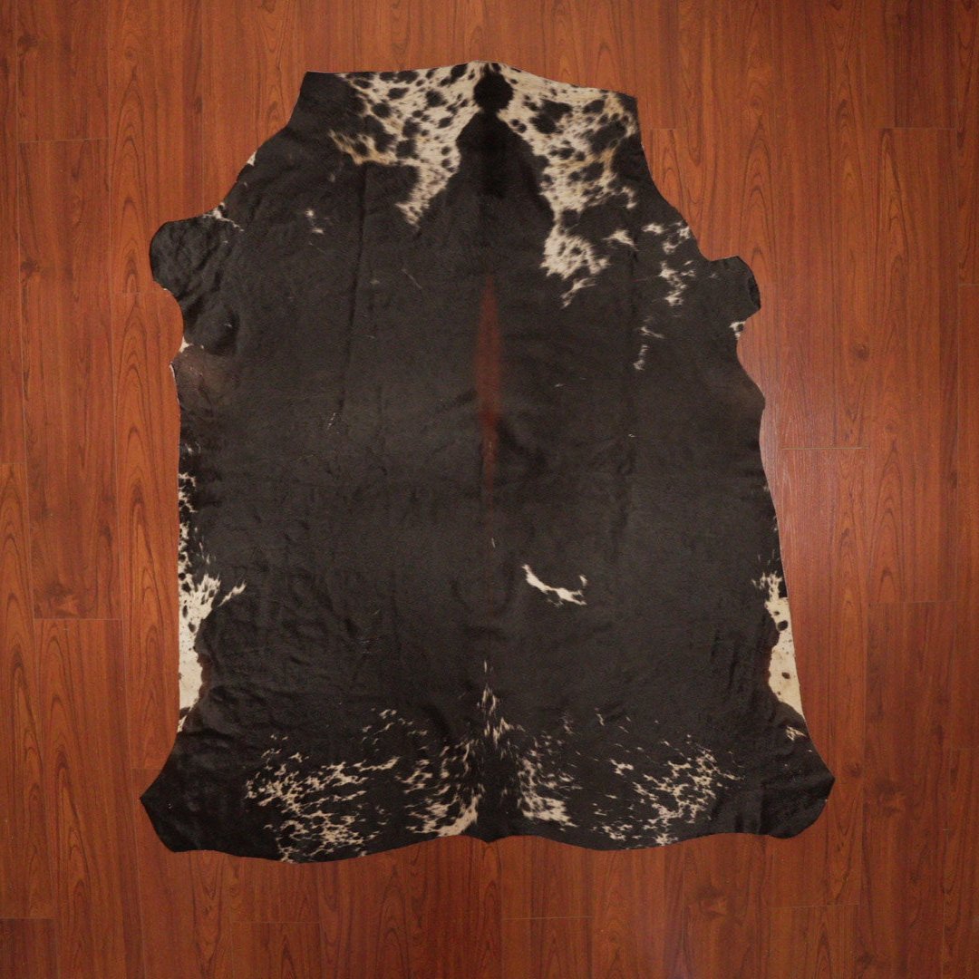 The Nguni Guy Nguni cowhide African decor Authentic cowhide Home decor Interior design Unique pattern Hand-selected Premium quality Natural beauty Exotic rug Genuine hide Statement piece Contemporary style Ethically sourced Sustainable decor Versatile accent Luxury rug Designer piece Modern aesthetic High-end craftsmanship Timeless elegance Designer home accents