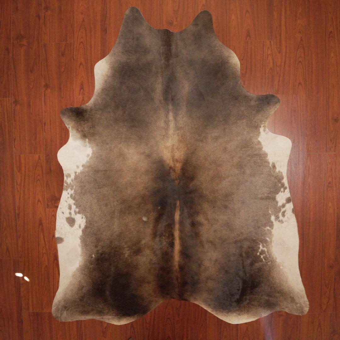 The Nguni Guy Nguni cowhide African decor Authentic cowhide Home decor Interior design Unique pattern Hand-selected Premium quality Natural beauty Exotic rug Genuine hide Statement piece Contemporary style Ethically sourced Sustainable decor Versatile accent Luxury rug Designer piece Modern aesthetic High-end craftsmanship Timeless elegance Designer home accents