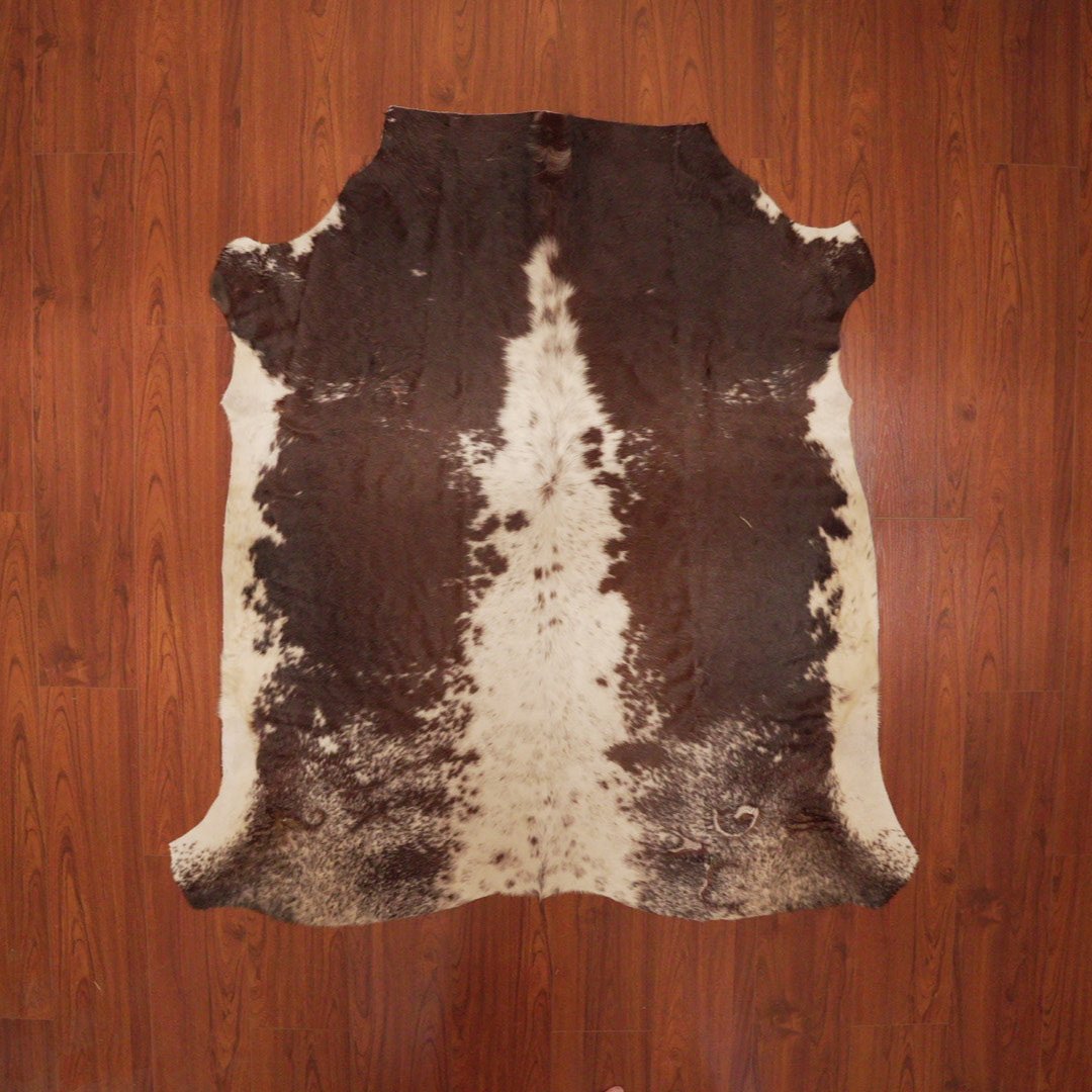 The Nguni Guy Nguni cowhide African decor Authentic cowhide Home decor Interior design Unique pattern Hand-selected Premium quality Natural beauty Exotic rug Genuine hide Statement piece Contemporary style Ethically sourced Sustainable decor Versatile accent Luxury rug Designer piece Modern aesthetic High-end craftsmanship Timeless elegance Designer home accents