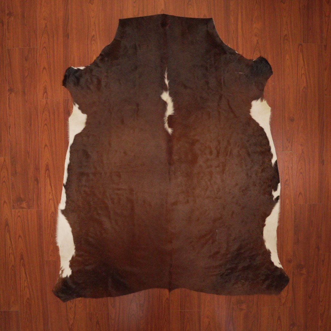 The Nguni Guy Nguni cowhide African decor Authentic cowhide Home decor Interior design Unique pattern Hand-selected Premium quality Natural beauty Exotic rug Genuine hide Statement piece Contemporary style Ethically sourced Sustainable decor Versatile accent Luxury rug Designer piece Modern aesthetic High-end craftsmanship Timeless elegance Designer home accents