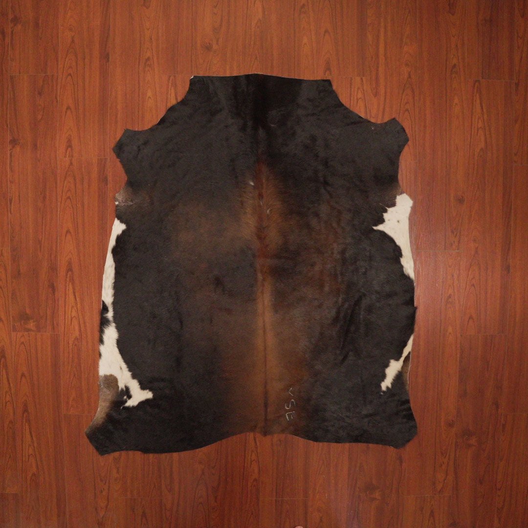 The Nguni Guy Nguni cowhide African decor Authentic cowhide Home decor Interior design Unique pattern Hand-selected Premium quality Natural beauty Exotic rug Genuine hide Statement piece Contemporary style Ethically sourced Sustainable decor Versatile accent Luxury rug Designer piece Modern aesthetic High-end craftsmanship Timeless elegance Designer home accents