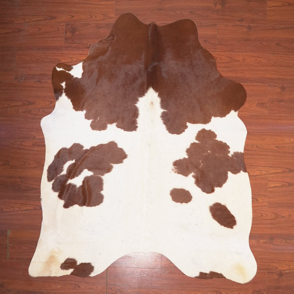 The Nguni Guy Nguni cowhide African decor Authentic cowhide Home decor Interior design Unique pattern Hand-selected Premium quality Natural beauty Exotic rug Genuine hide Statement piece Contemporary style Ethically sourced Sustainable decor Versatile accent Luxury rug Designer piece Modern aesthetic High-end craftsmanship Timeless elegance Designer home accents
