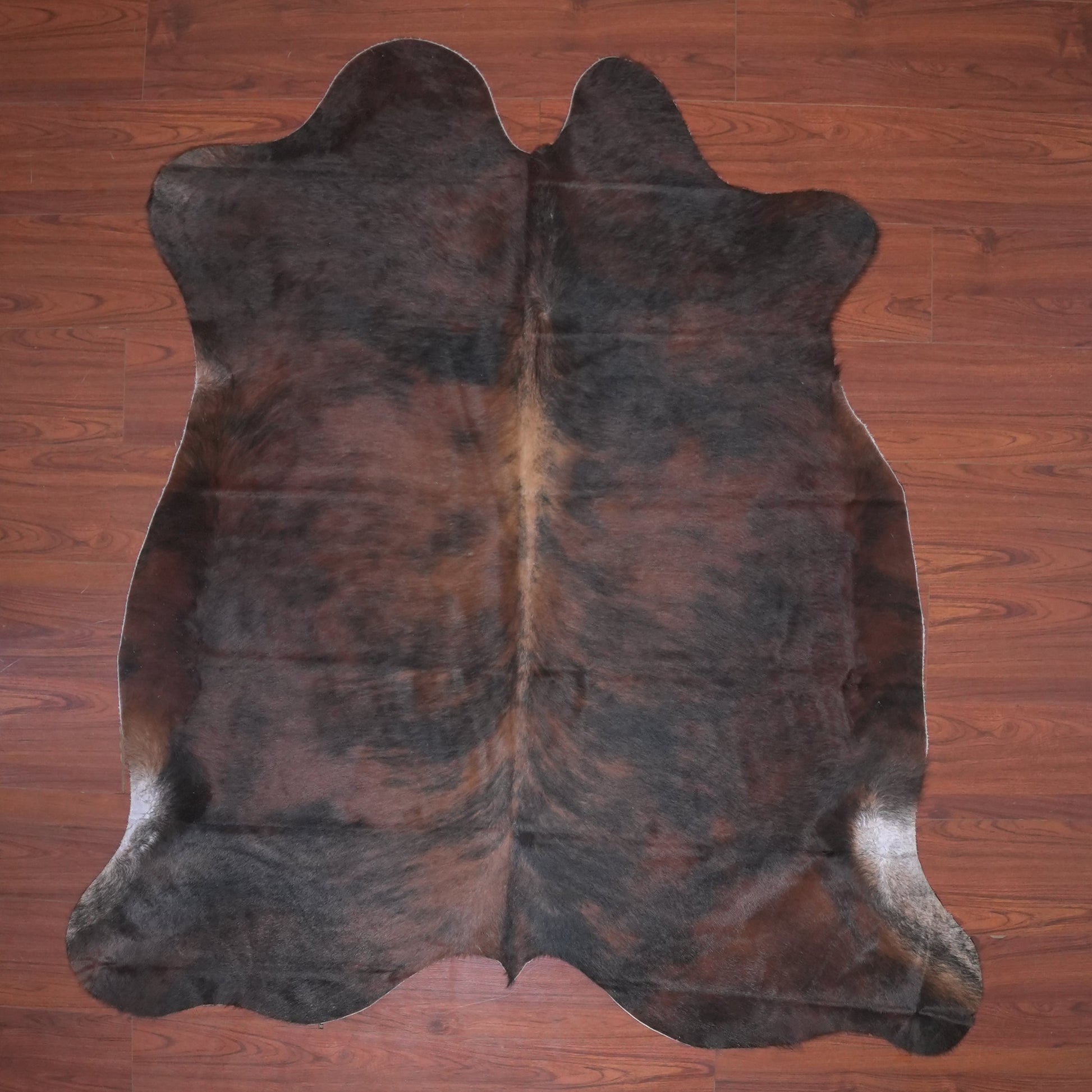 The Nguni Guy Nguni cowhide African decor Authentic cowhide Home decor Interior design Unique pattern Hand-selected Premium quality Natural beauty Exotic rug Genuine hide Statement piece Contemporary style Ethically sourced Sustainable decor Versatile accent Luxury rug Designer piece Modern aesthetic High-end craftsmanship Timeless elegance Designer home accents