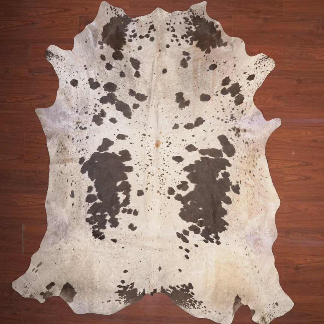 cow hide rug on wood floor