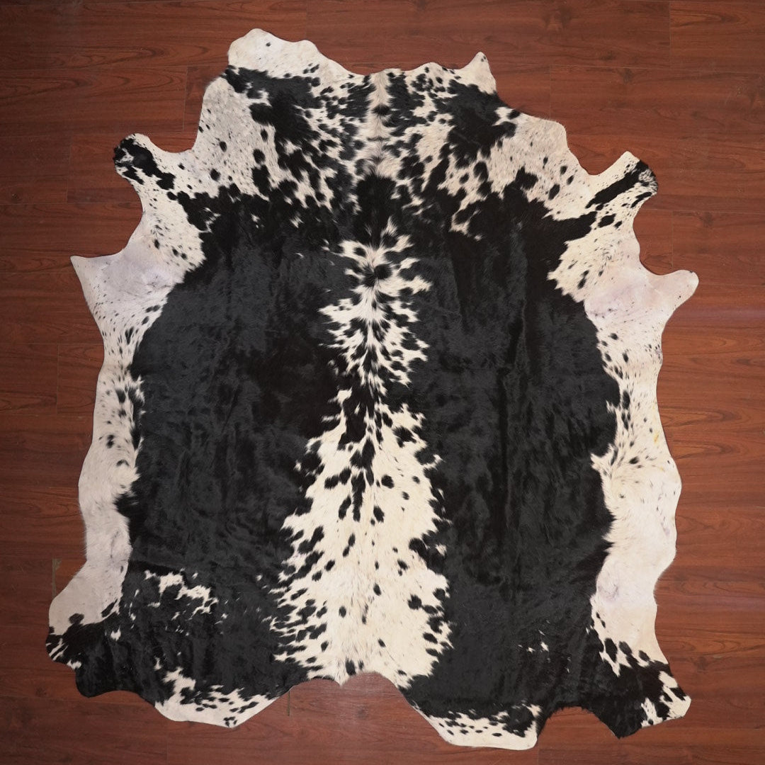cow hide rug on wood floor
