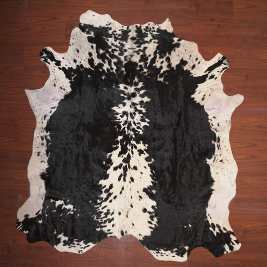 cow hide rug on wood floor