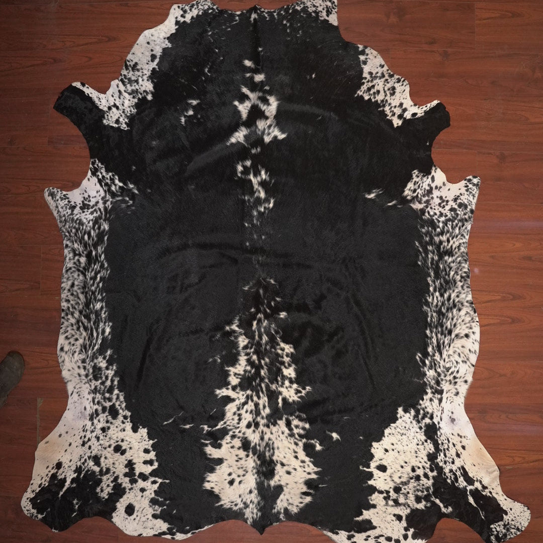 cow hide rug on wood floor
