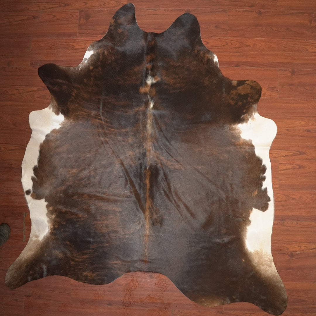cow hide rug on wood floor