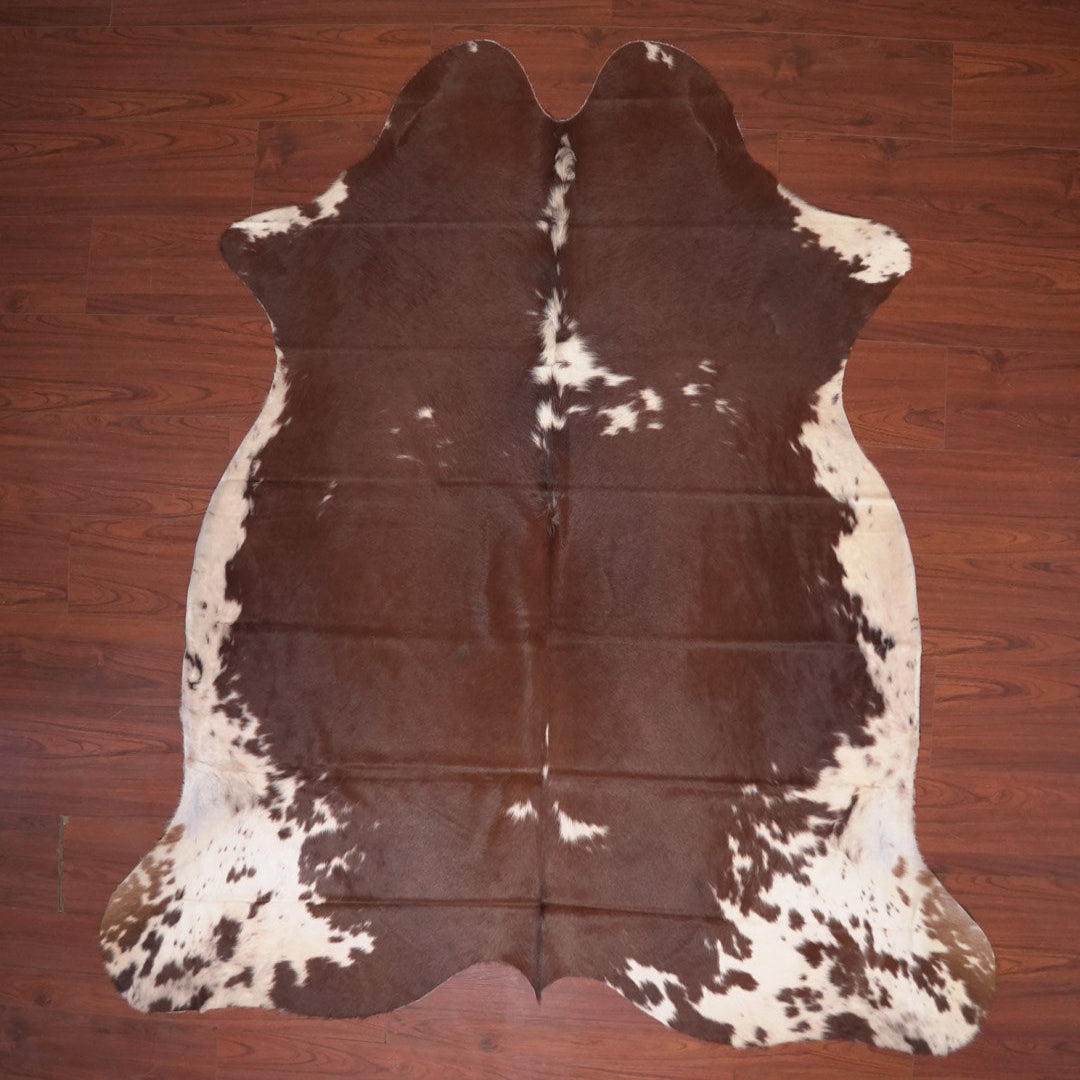 cow hide rug on wood floor