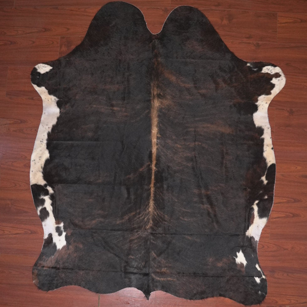 cow hide rug tricolour on wood floor