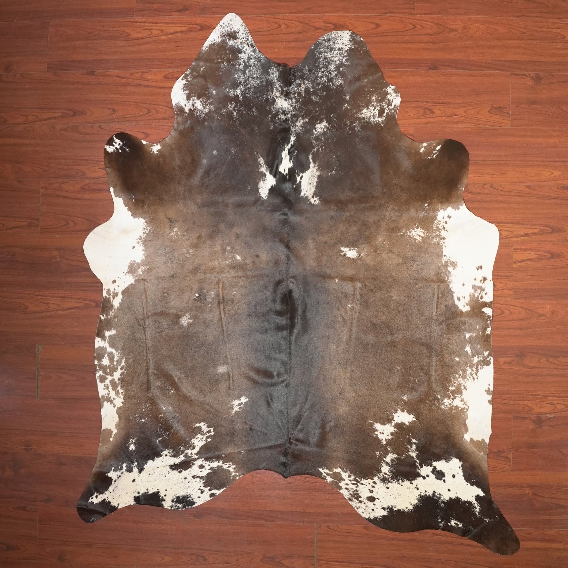 The Nguni Guy Nguni cowhide African decor Authentic cowhide Home decor Interior design Unique pattern Hand-selected Premium quality Natural beauty Exotic rug Genuine hide Statement piece Contemporary style Ethically sourced Sustainable decor Versatile accent Luxury rug Designer piece Modern aesthetic High-end craftsmanship Timeless elegance Designer home accents
