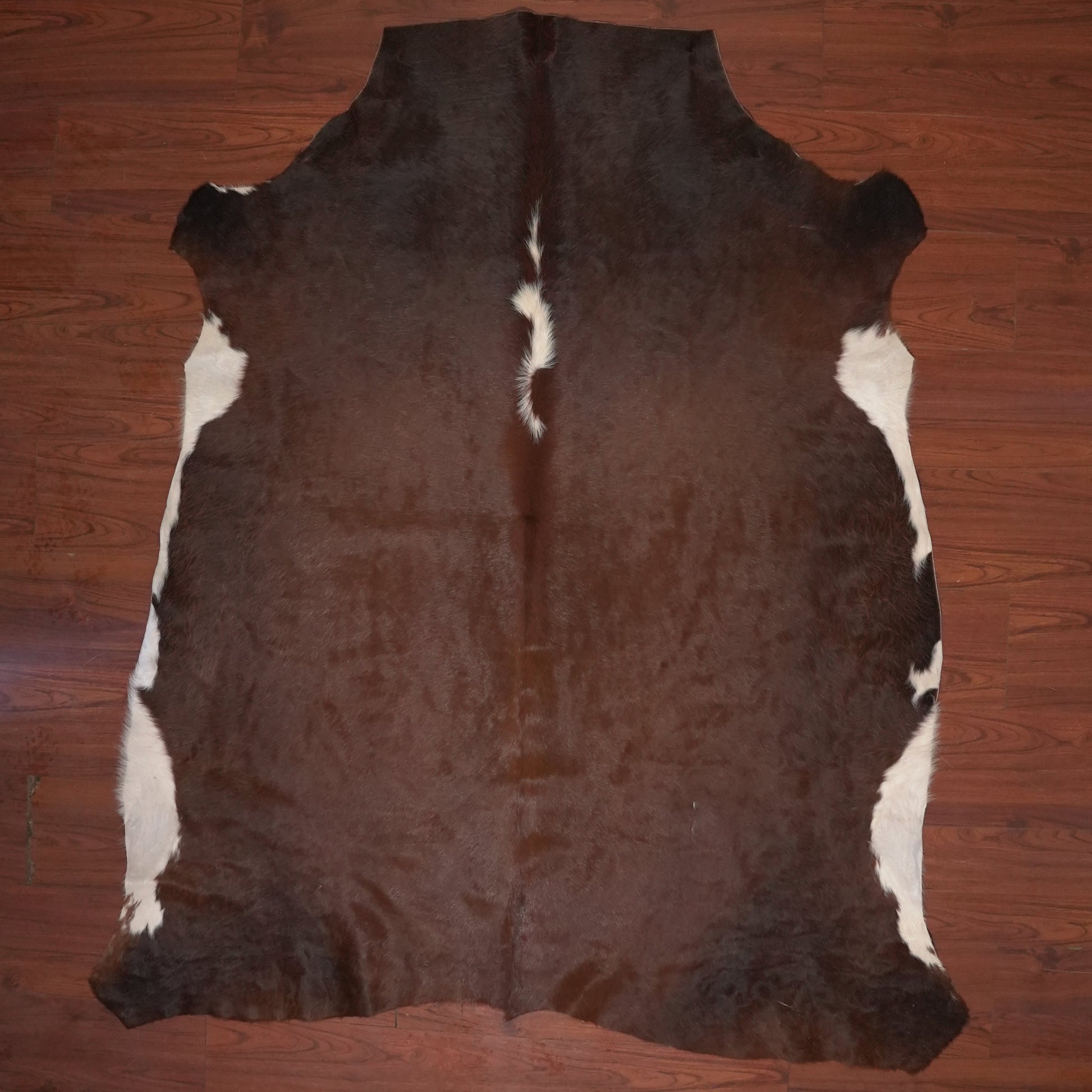 cowhide rug on wood floor
