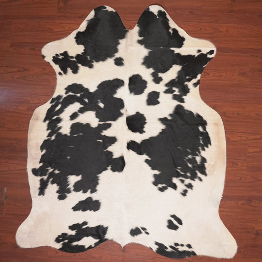 cow hide rug on wood floor