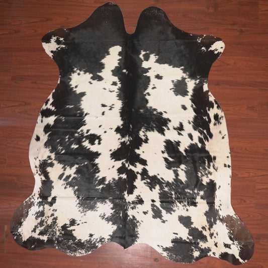 cow hide rug on wood floor