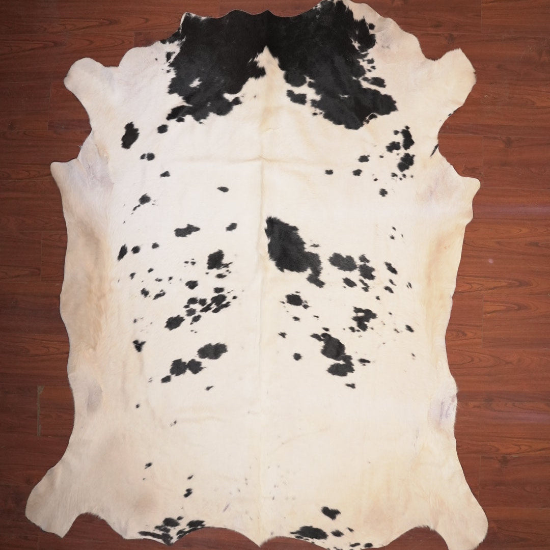 cow hide rug on wood floor