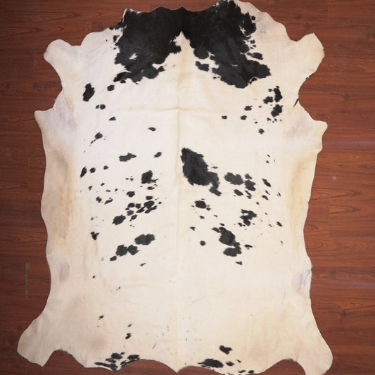cow hide rug on wood floor