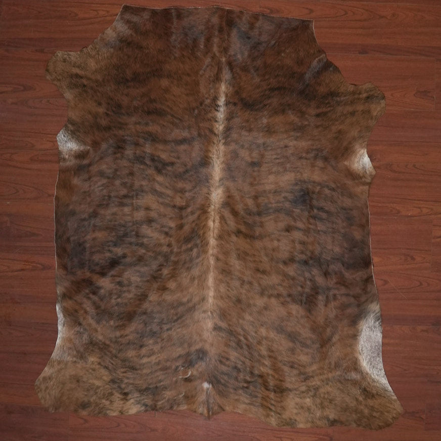 Brown fur rug on a wooden floor