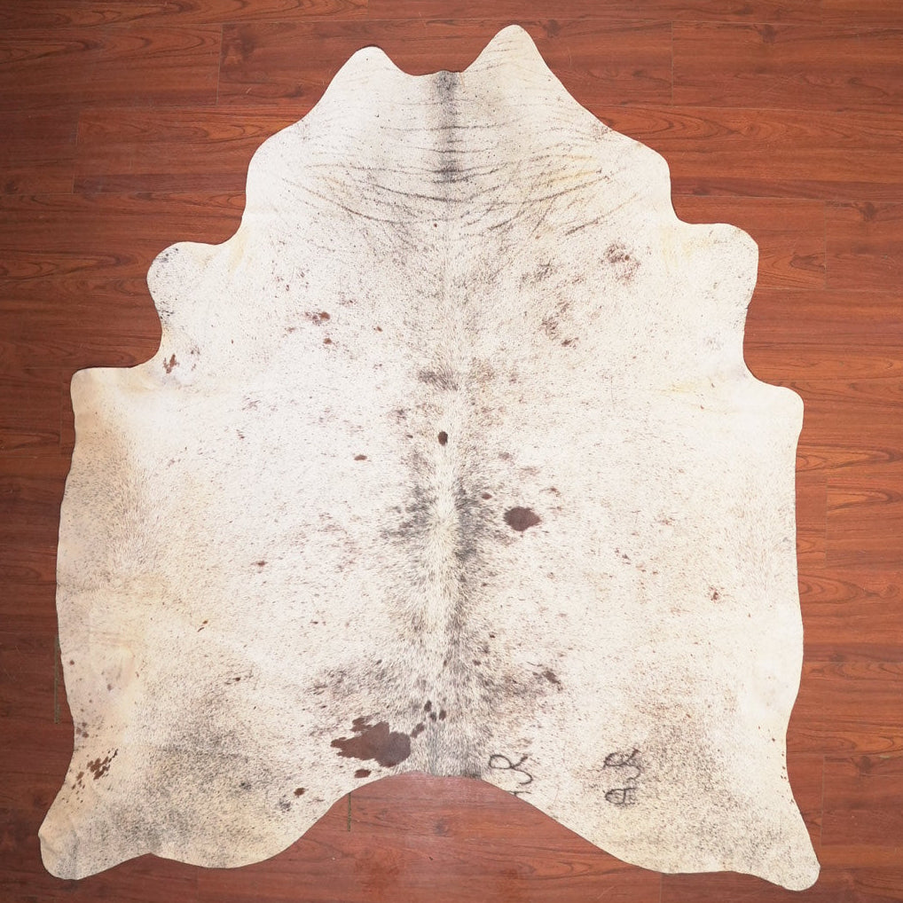 Cowhide rug on a wooden floor
