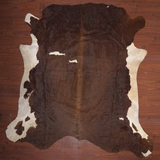 cow hide rug on wood floor