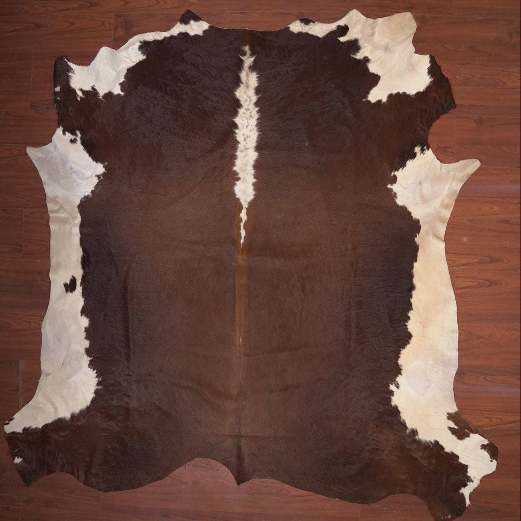 cow hide rug on wood floor